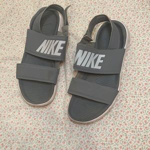 Grey and white Nike sandals